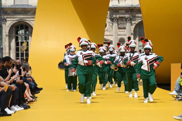 Louis Vuitton cranked up the volume at Paris Fashion Week on Thursday, spiriting Florida's famous Marching 100 band into the heart of the Louvre to kick off a show for its latest line-up of colourful menswear styles. Getty Images