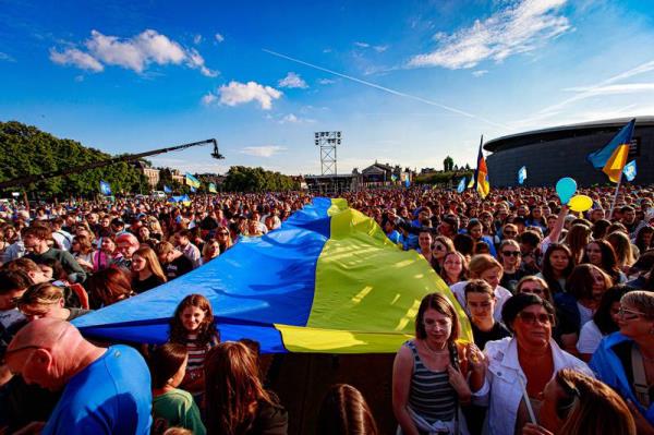 A giant Ukrainian flag is held up during the benefit co<em></em>ncert 'Embrace Ukraine' on the Museumplein in Amsterdam.  The free event will raise mo<em></em>ney for victims of the war in Ukraine and the purchase of mobile X-ray equipment that the country needs.   EPA 