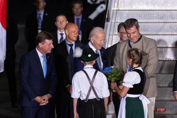 US President Joe Biden was greeted by children in traditio<em></em>nal Bavarian dress after arriving in Germany. Bloomberg. 