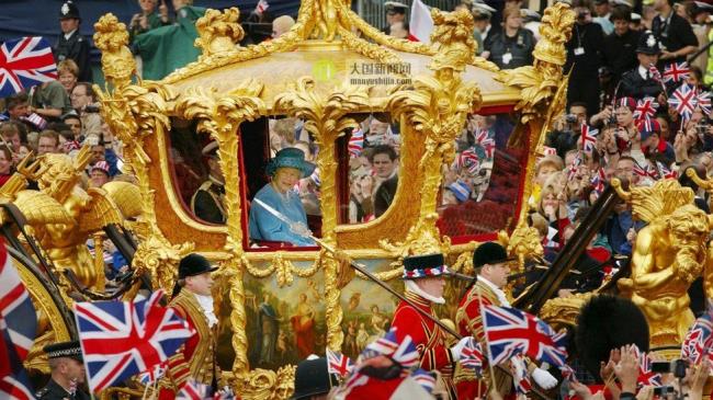 The Queen rides in the Golden State carriage during her Golden Jubilee in 2002