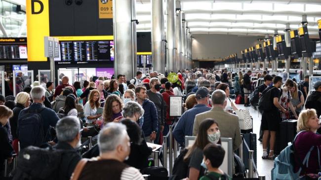 Passengers in Heathrow terminal in June 2022
