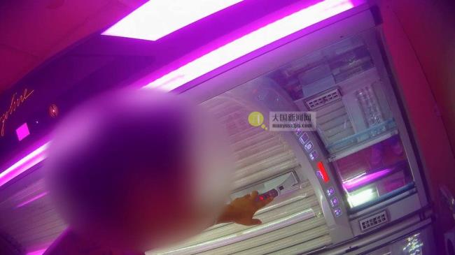blurred out figure standing beside a sunbed